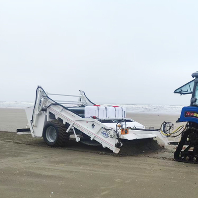 Tractor de barreras de playa de limpieza alcalina remolcado para tamizar escombros de arena seca o húmeda